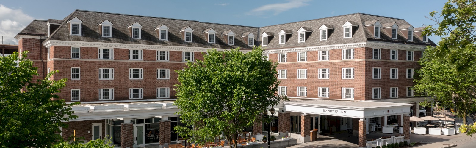 A large brick building with multiple windows, labeled 