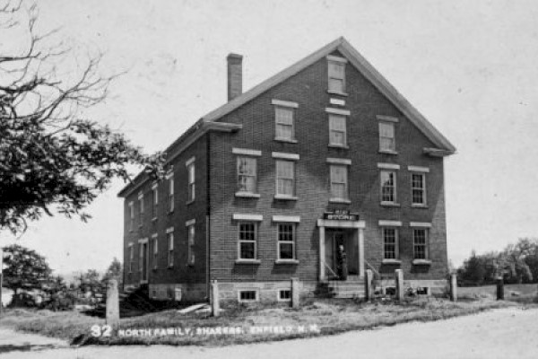 A historic three-story brick building labeled 