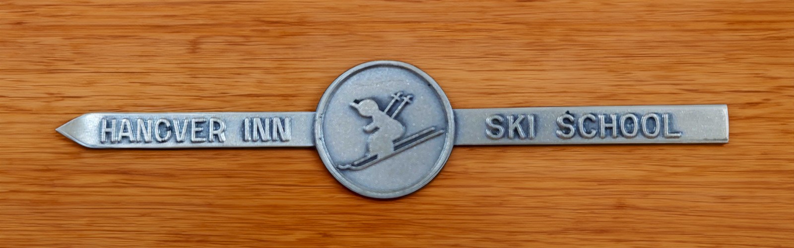 A metal emblem with 