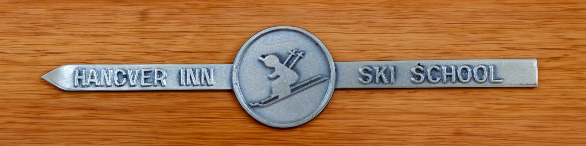 A metal emblem with 